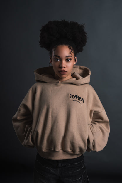 Front view of SYREN 1.0 hoodie, highlighting unique pocket design and baggy fit